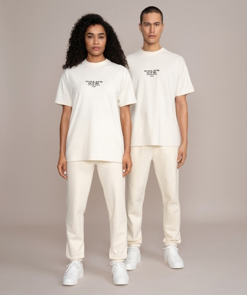 White unisex sweatpants from Gold's Gym. Long joggers with embroidered Gold's Gym Weight Pate logo on the leg, waistband and drawstring.  White unisex sweatpants from Gold's Gym. Long joggers with embroidered Gold's Gym Weight Pate logo on the leg, waistband and drawstring.