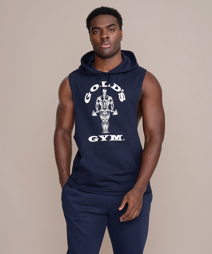 Navy sleeveless hoodie from Gold's Gym. Navy tank with hood and cords, sleeveless, with white Gold's Gym Muscle Joe logo and fanny pack on the front.