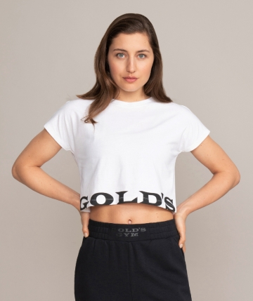 White crop top t-shirt with black Gold's Gym logo lettering on the front & back. White crop top t-shirt with black Gold's Gym logo lettering on the front & back.
