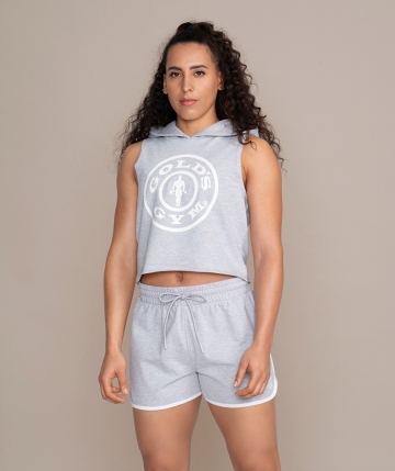 Preview: Grey sleeveless crop hoodie for women from Gold's Gym.  Women's sleeveless hooded top with Gold's Gym Weight Plate logo on the front.  Preview: Grey sleeveless crop hoodie for women from Gold's Gym.  Women's sleeveless hooded top with Gold's Gym Weight Plate logo on the front.