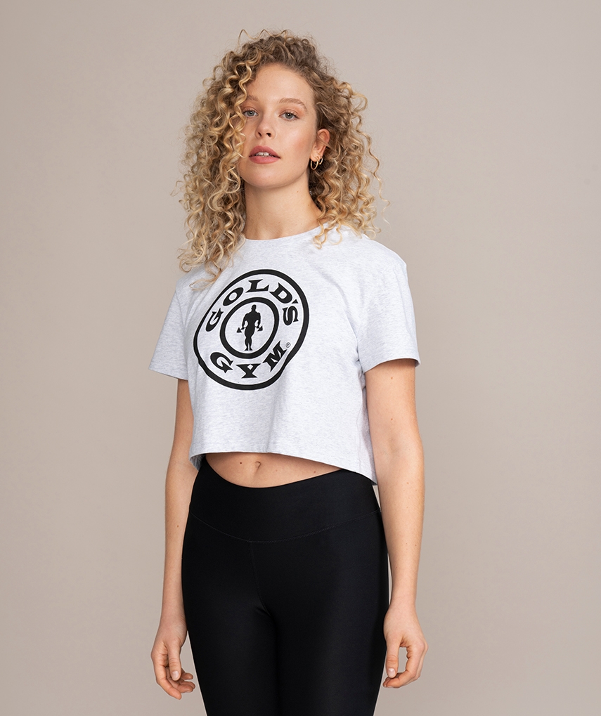 Graues Damen Crop mit schwarzem Gold’s Gym Weightplate Logo auf der Vorderseite
