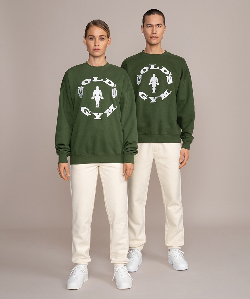 Olive green unisex sweatshirt from Gold's Gym. Oversized long sleeve top with embroidered Gold's Gym Weight Plate logo on the front and lettering on the back.