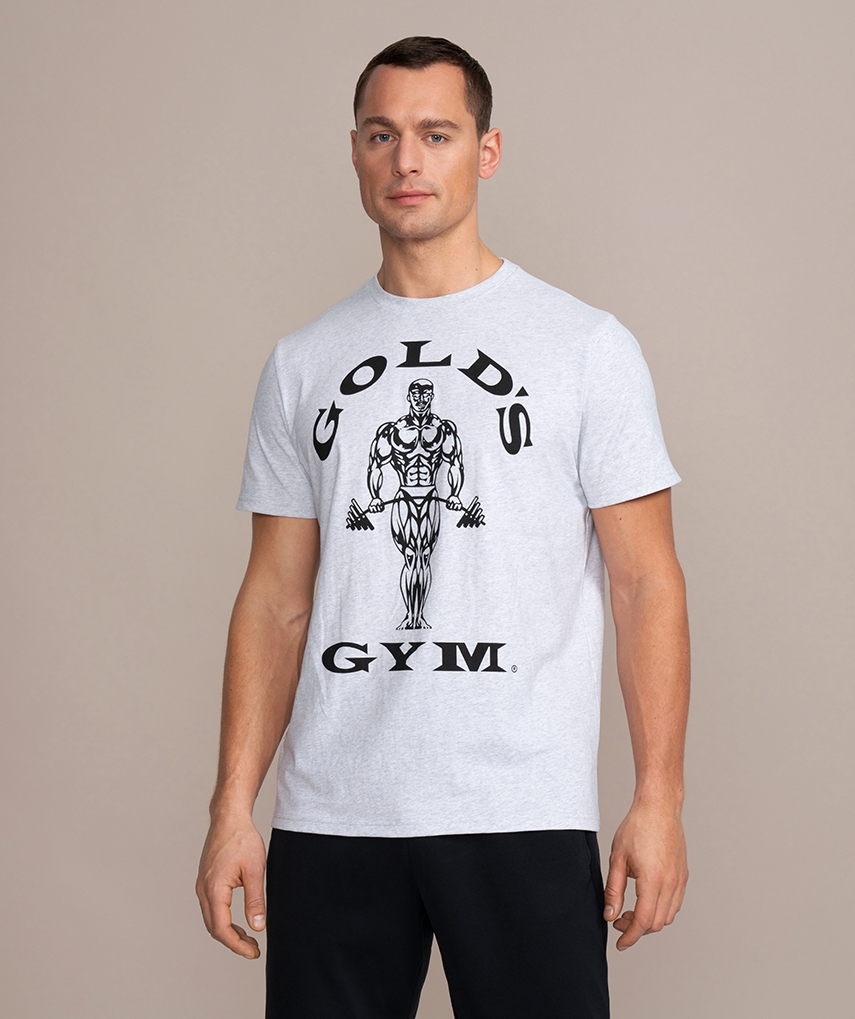graues Sport T-Shirt von Gold's Gym. Kurzarm mit dem schwarzen Muscle Joe Logo und schwarzer Schrift auf der Brust. 